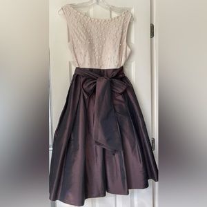 Jessica Howard cream and brown dress with pearls.